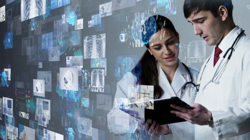 Two doctors in white coats are reviewing information on a tablet. Behind them are various semi-transparent medical images and graphics, including X-rays, anatomical diagrams, and data charts, suggesting a high-tech healthcare environment leveraging cloud technology.